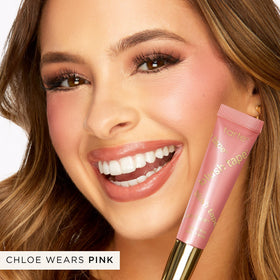 tarte applying blush with fingers for seamless blending and natural radiance