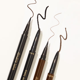 tarte eyeliner held in hand to show compact size and portability
