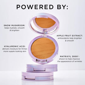 tarte compact next to coin for size comparison and travel ease