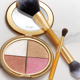 tarte palette next to coin showing compact travel-friendly scale