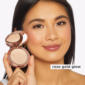 tarte highlighter inside makeup bag in lifestyle scene, highlights everyday use