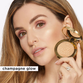 tarte close-up texture of pressed highlighter, shows buttery smooth finish