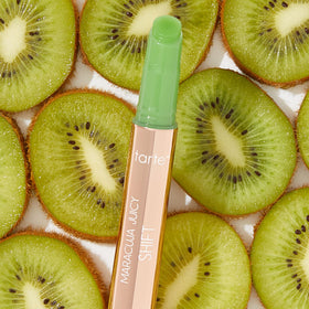tarte lifestyle woman smiling wearing gloss-balm, showing hydrated, fuller-looking lips