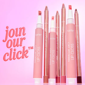 tarte flatlay on vanity with gloss and charm emphasizing playful routine