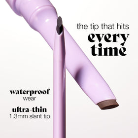 tarte quick stick held in hand to show scale and travel-friendly convenience