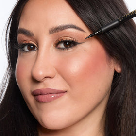tarte sex kitten liner in hand application showing effortless wing creation
