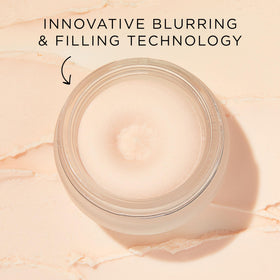 tarte timeless primer held in hand to show full-size scale and travel-friendly benefit