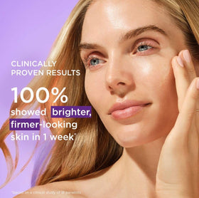 Closeup of serum texture on fingertip showing lightweight consistency and quick absorption