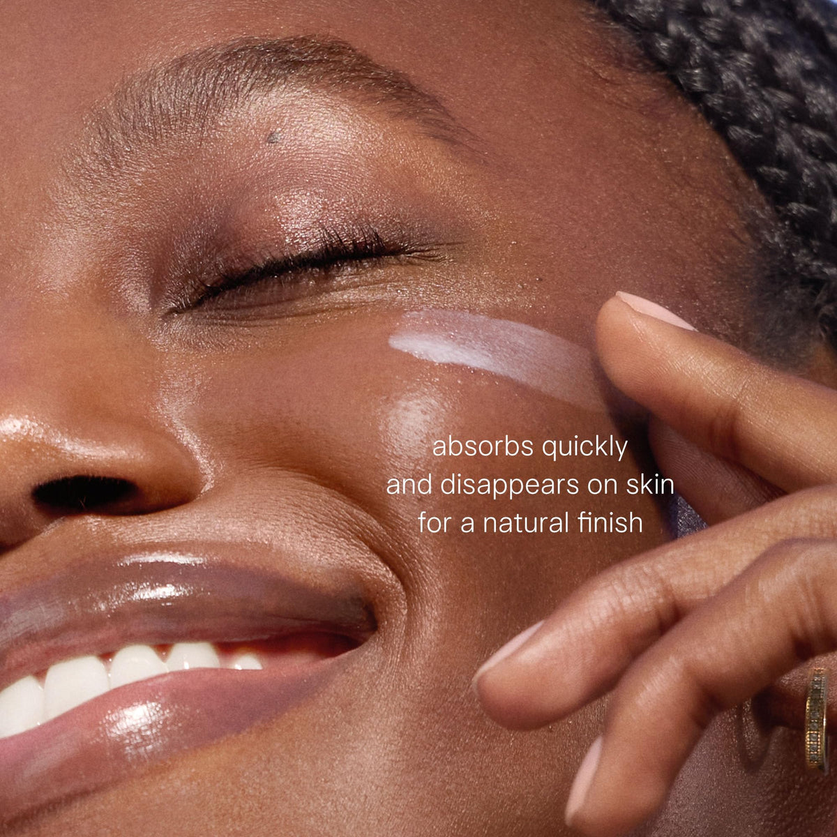 TATCHA Milky Sunscreen blended on hand illustrating no white cast benefit