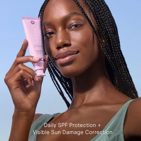 TATCHA Milky Sunscreen dispensing pump demonstrating convenient hygienic use