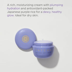TATCHA starter set next to coin and hand to show compact travel-size scale