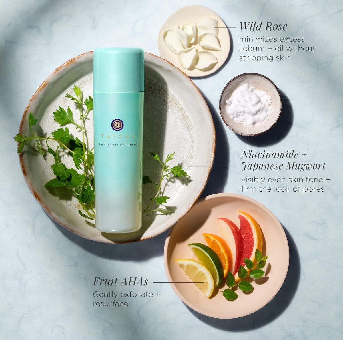 TATCHA bottle staged with other skincare showing routine compatibility benefit