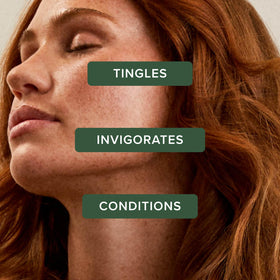 Tea Tree conditioner texture pouring from bottle, showing creamy slip for detangling