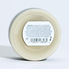 Fresh tea tree leaves beside Tea Tree forming cream to emphasize natural scent and invigorating benefit