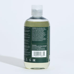 Tea Tree shampoo staged on bathroom shelf with towels, evokes refreshing routine