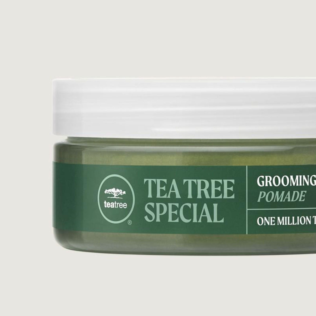 Tea Tree pomade styling damp curls to define waves and reduce frizz