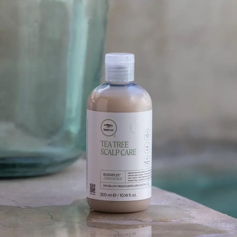 Tea Tree conditioner applied to hair mid-lengths demonstrating detangling