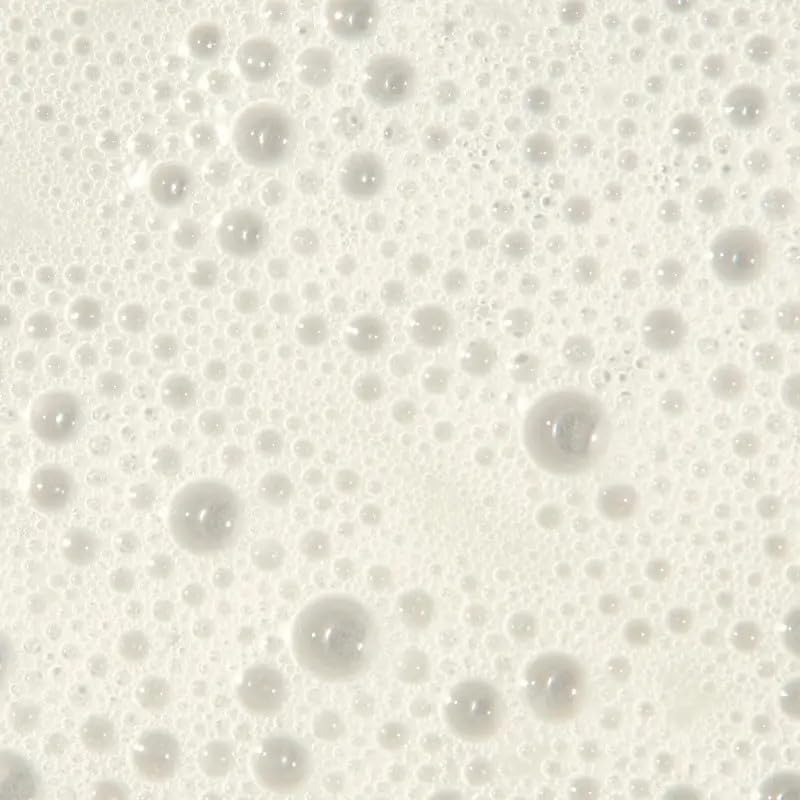 Tea Tree shampoo on bathroom shelf styled for routine use and uplifting citrus scent