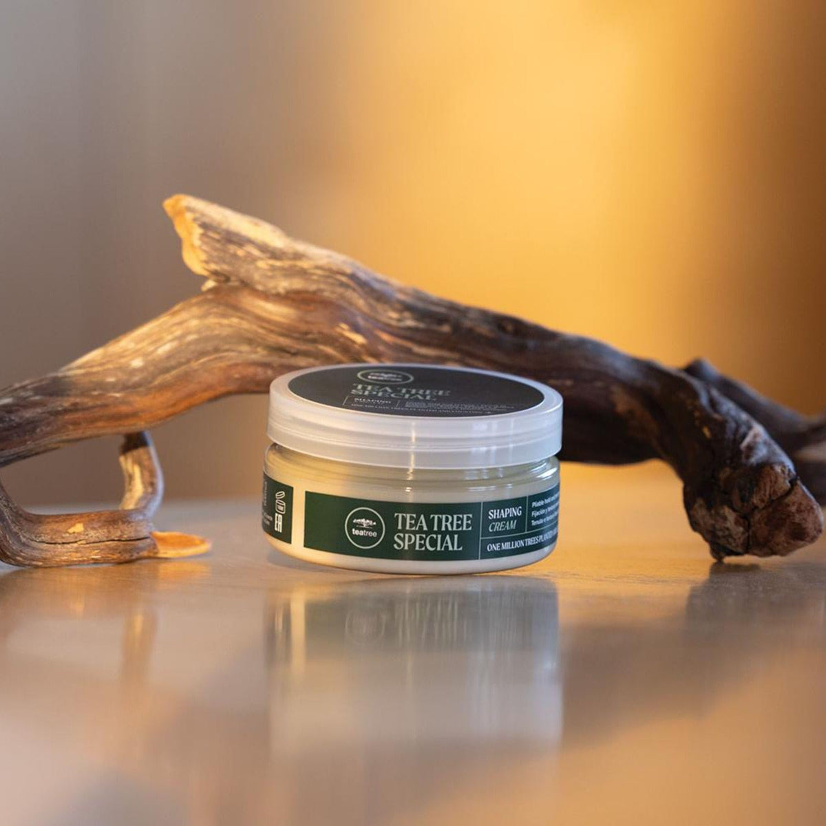 Tea Tree jar on bathroom counter suggesting salon-quality routine