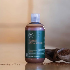 Tea Tree bottle in shower scene demonstrating refreshing tingle use