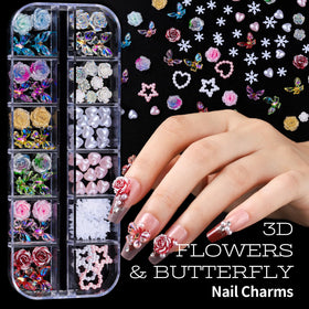 Teenitor charms and rhinestones spread on table displaying variety for creative designs