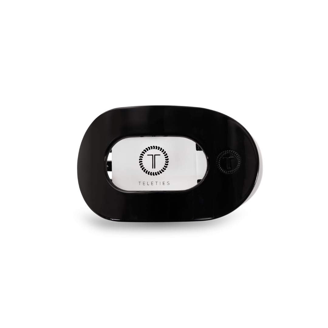 TELETIES flat round clip front view showing sleek jet black profile and secure hold