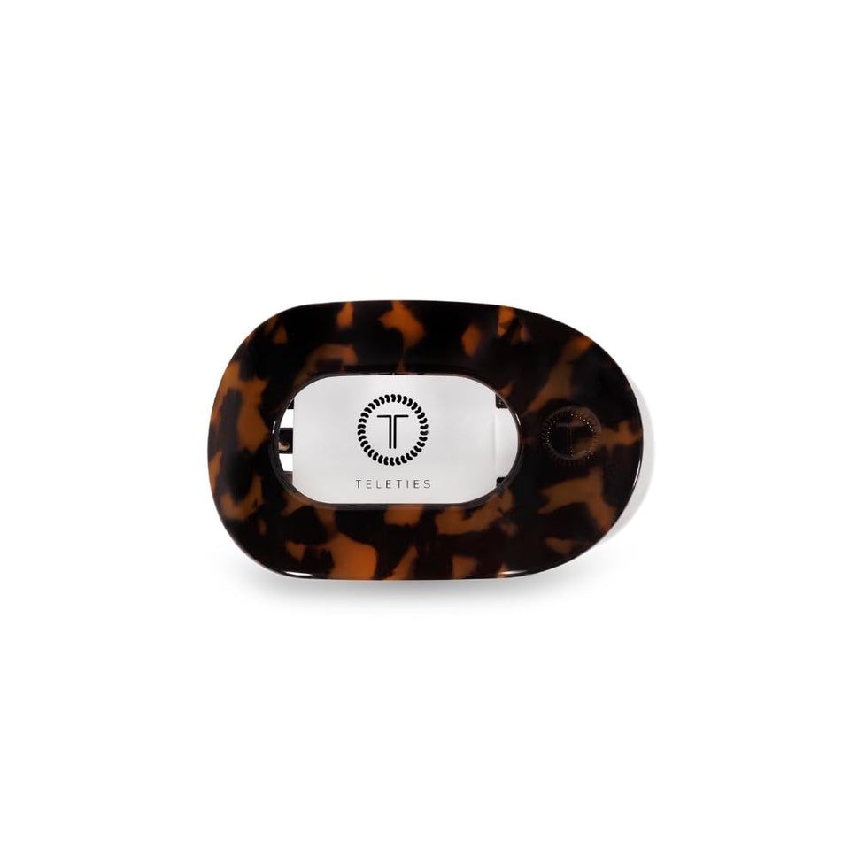 TELETIES flat round clip front view showing tortoise finish and sleek profile benefit comfort