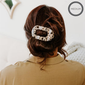 TELETIES clip securing a mid ponytail, demonstrates secure no-slip hold