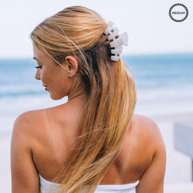 Teleties medium clip worn in half-up hairstyle for reliable styling