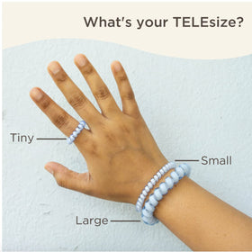 TELETIES with water droplets showcasing water-resistant material and quick-dry benefit