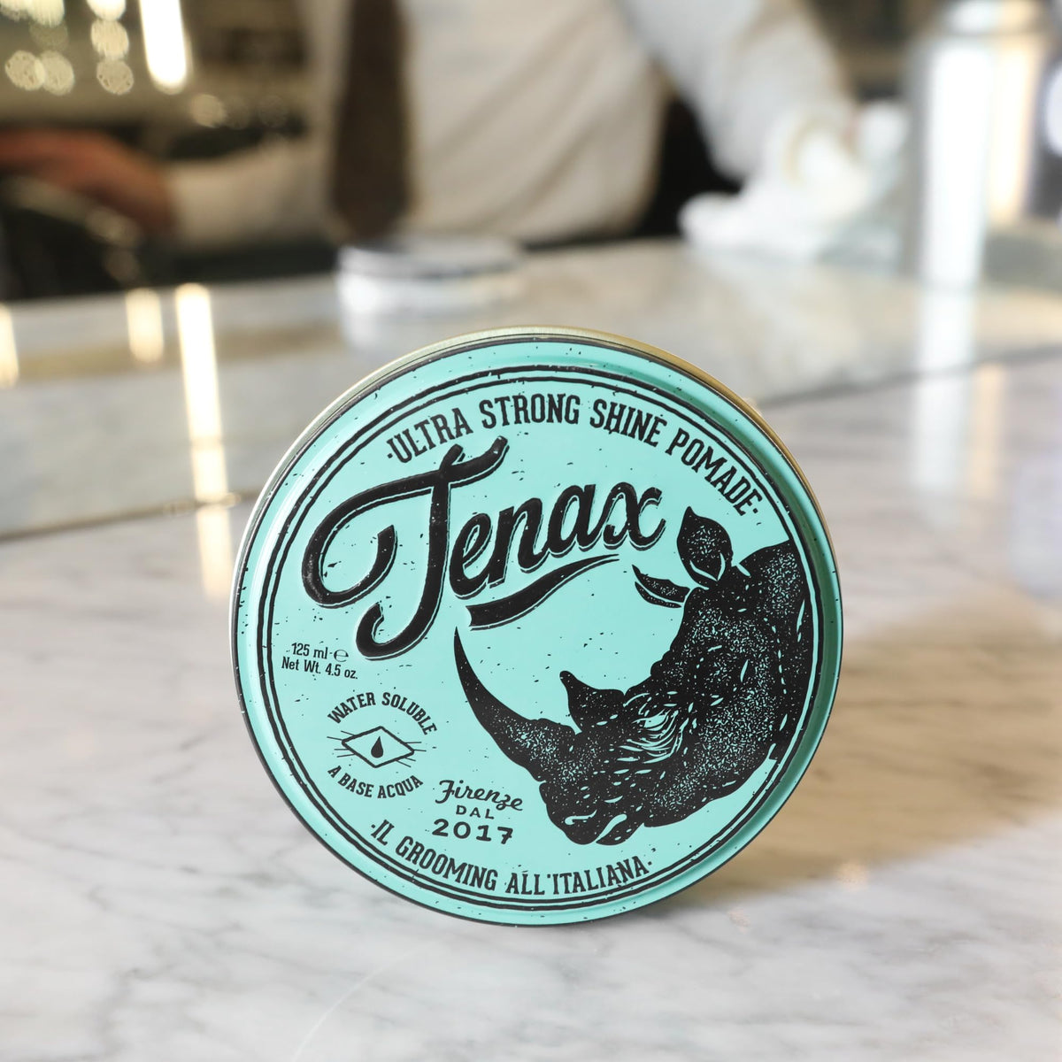 Close-up of Tenax pomade sheen highlighting maximum shine on hair
