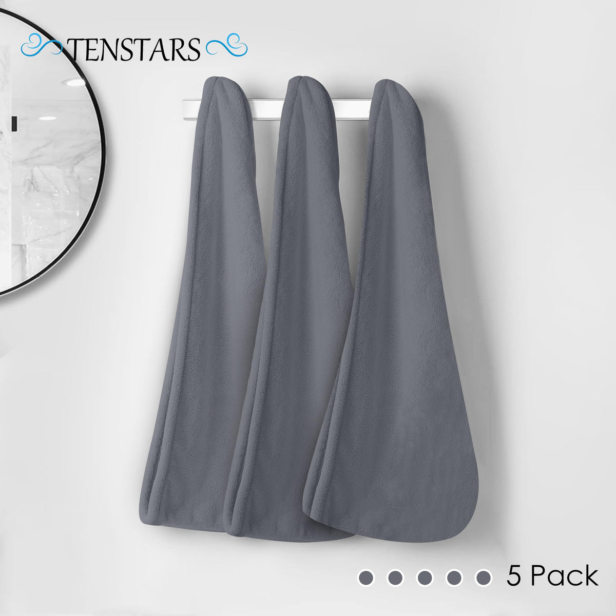 TENSTARS towel held in hand to show 11x28 inch compact travel size