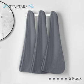 TENSTARS towel held in hand to show 11x28 inch compact travel size
