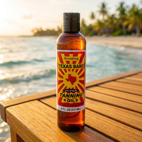 Texas Babe bottle on sand lifestyle shot, brand conveying beach-ready glow