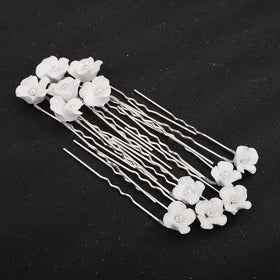 Teyglen close-up of flower and pearl detail for delicate bridal accents
