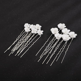 Teyglen pins in hand to show size and lightweight benefit