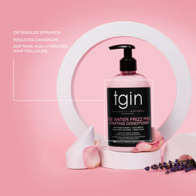 Thank God It's Natural pouring conditioner into hand for easy detangling demonstration