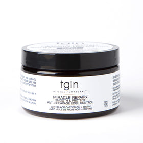 Thank God It's Natural texture close-up highlighting smooth, non-greasy formula for sleek edges