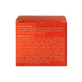 The Barb Shop jar in a travel pouch showing portability for on-the-go styling benefit