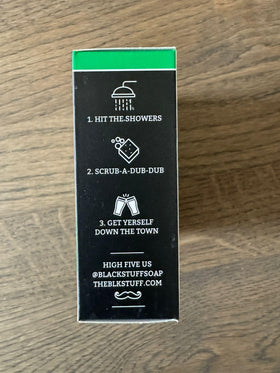 The Black Stuff in a shower setting showing everyday use and refreshing scent benefit