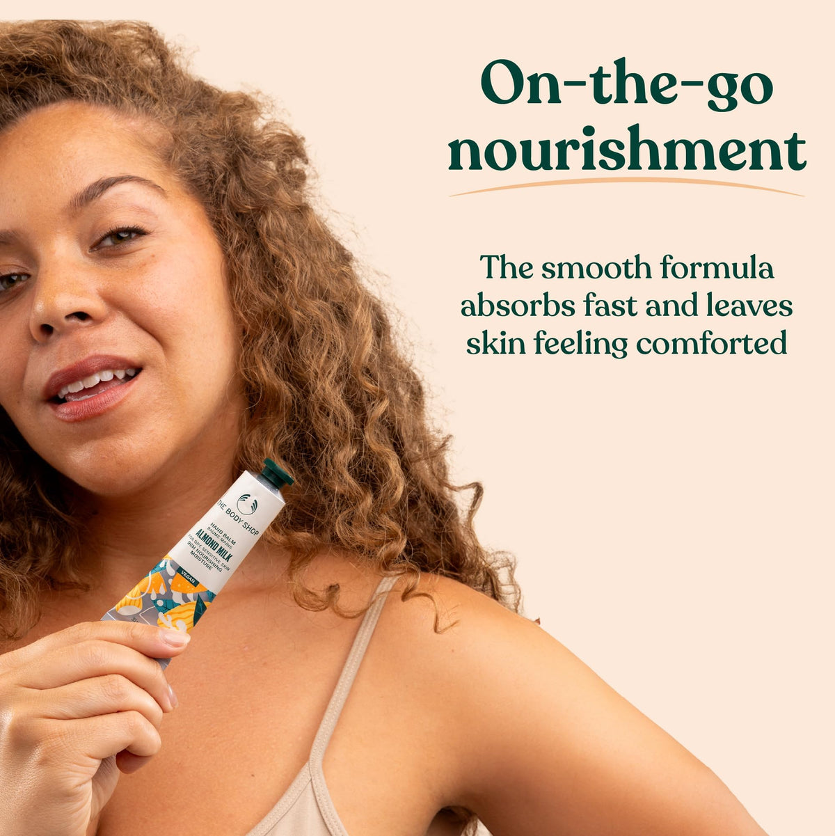 The Body Shop tube in palm for size comparison and convenient pocket portability benefit