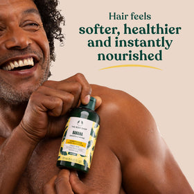 Shower scene with The Body Shop banana conditioner in use for smoother, detangled hair