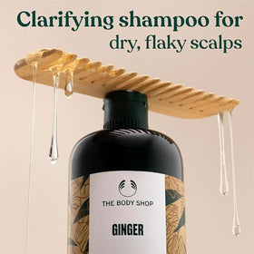 The Body Shop ginger shampoo creamy lather texture demonstrating gentle cleansing action