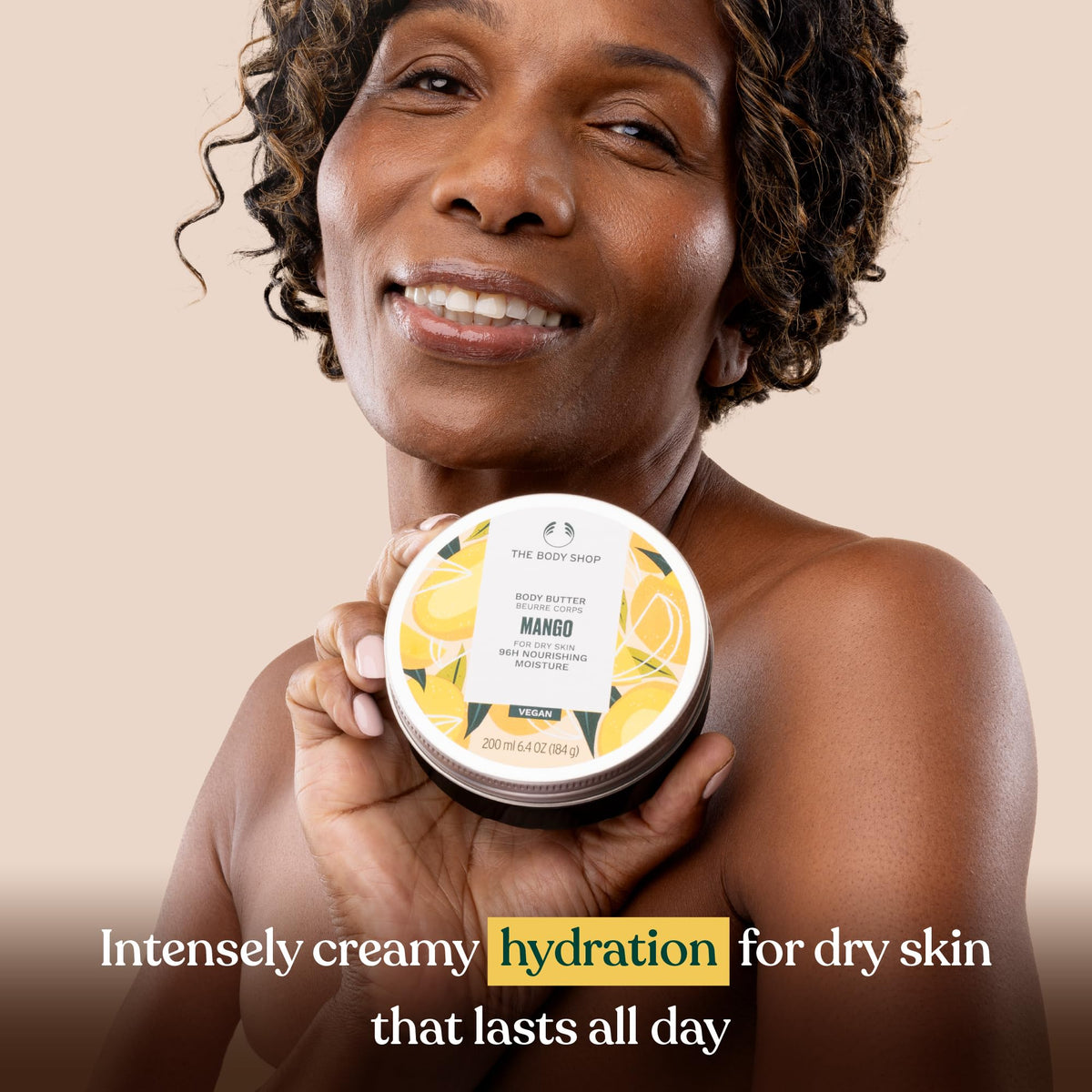 The Body Shop mango body butter being applied on hand for fast absorption