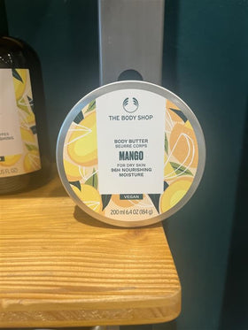 Morning bathroom scene with The Body Shop mango body butter in skincare routine