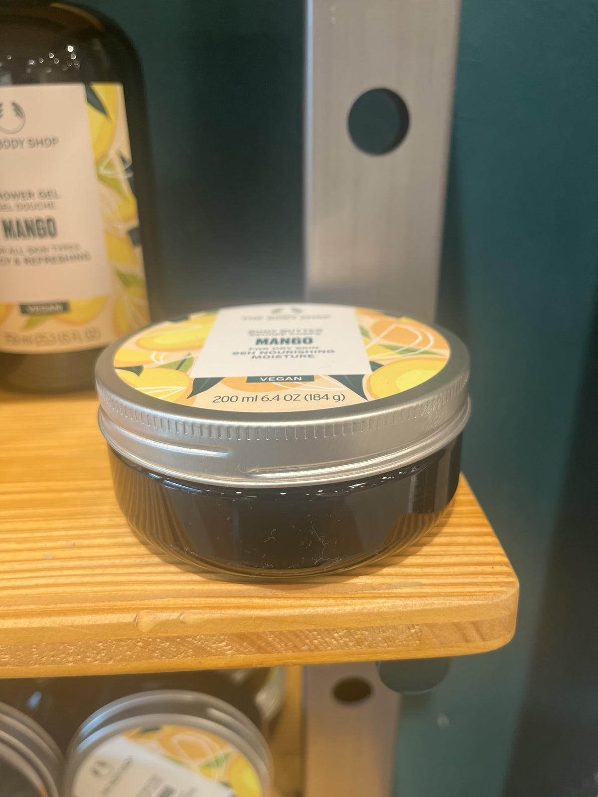 Label close-up showing The Body Shop ingredient claims and natural-origin content