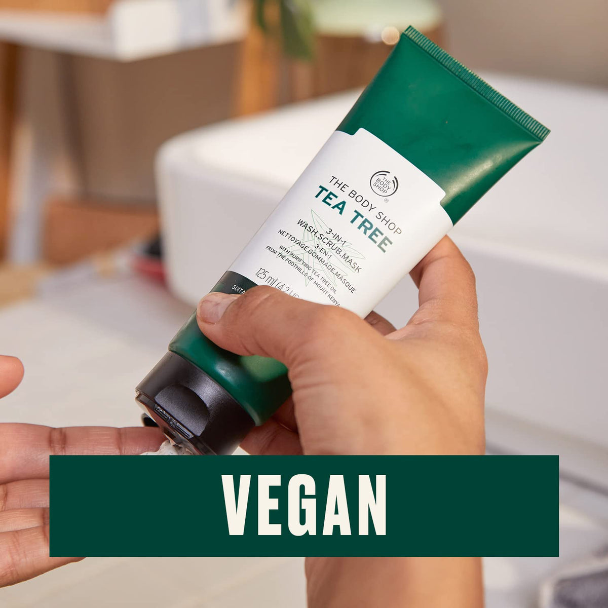 The Body Shop applying mask on model’s cheek to show clarifying effect and mattifying finish