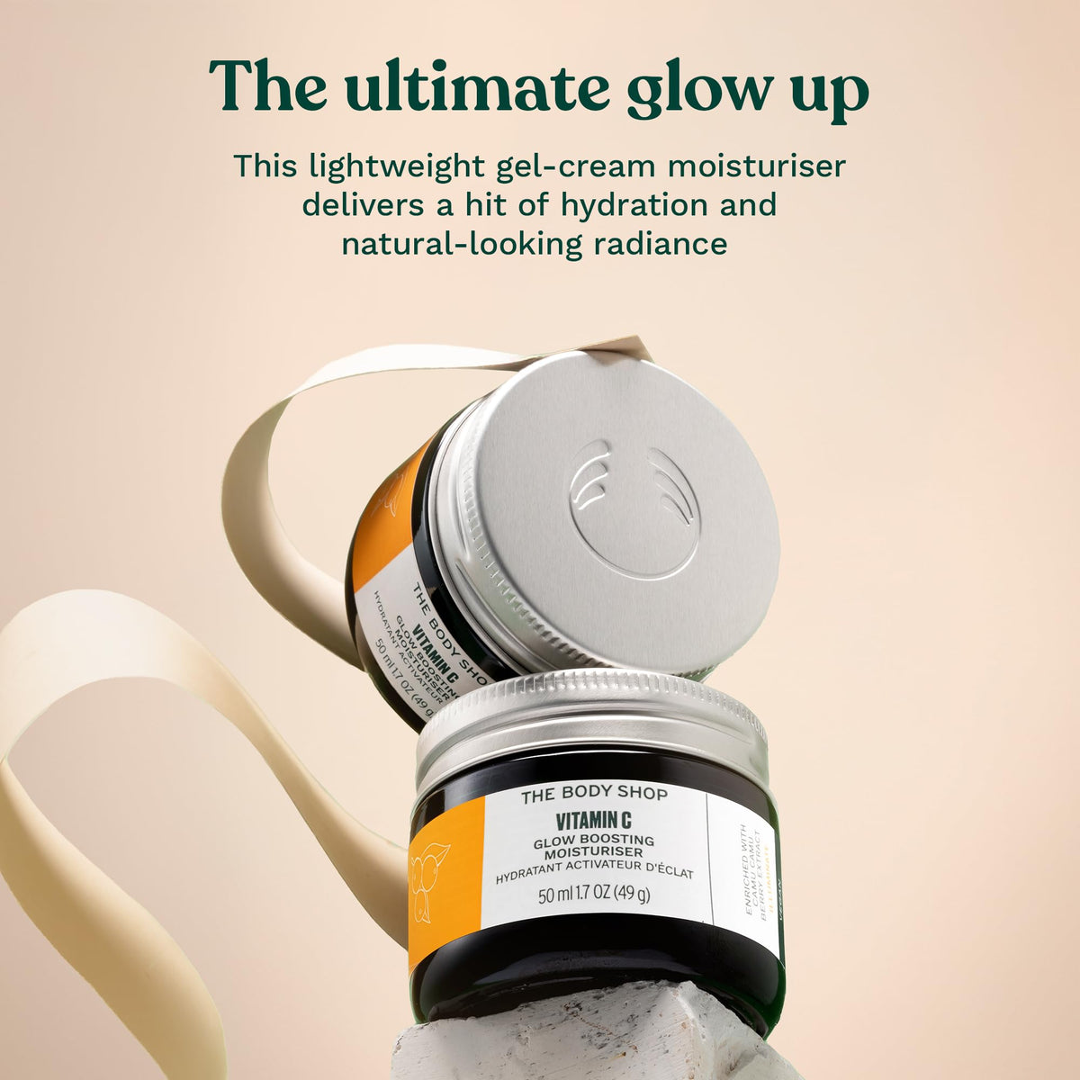 The Body Shop open jar top view highlighting smooth cream texture