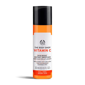 The Body Shop bottle front view showing product benefits and radiant packaging