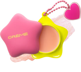 The Crème Shop front packaging showing cute keychain and compact balm